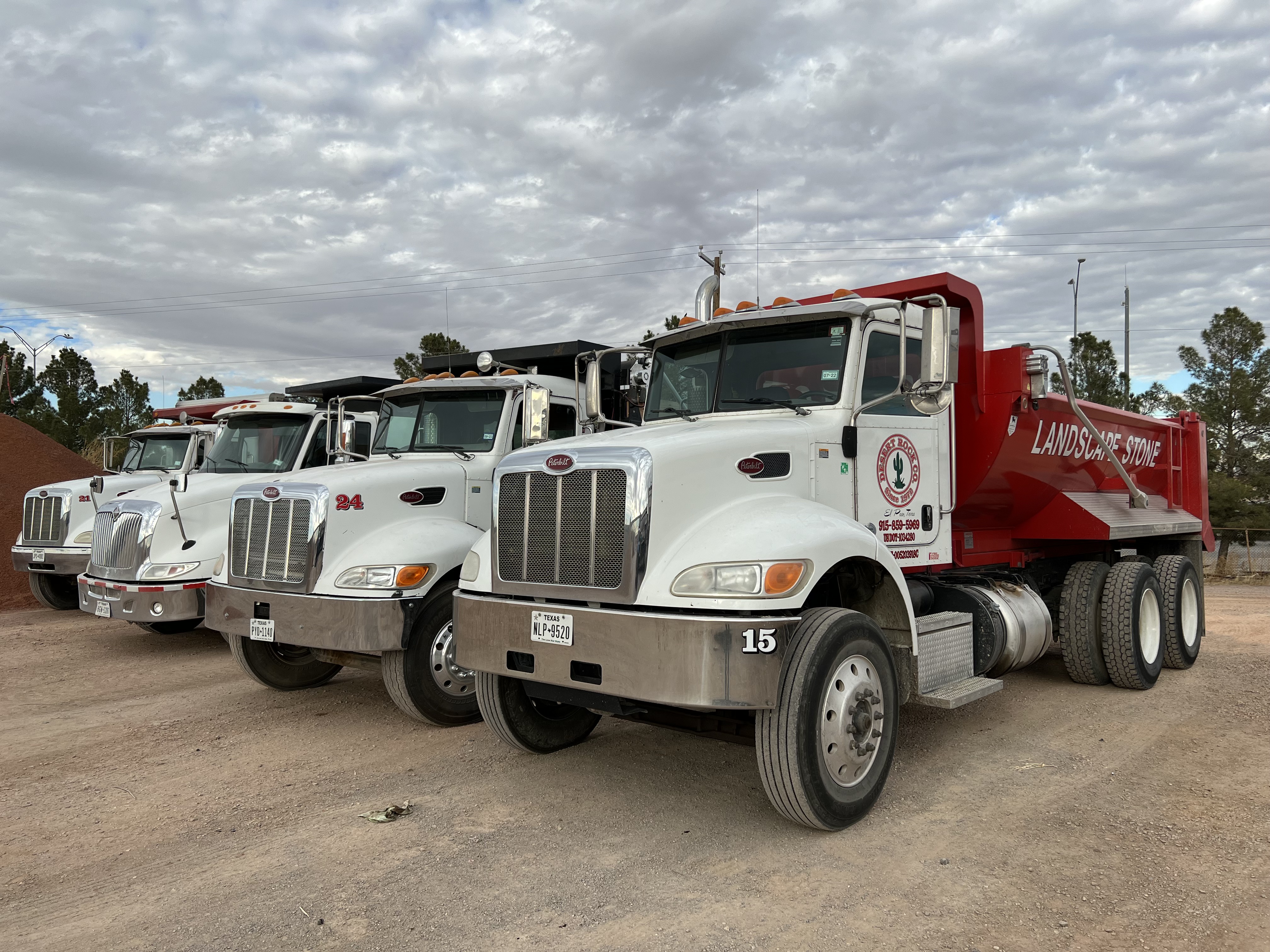 Delivery Trucks (Peterbilt rigs equipped with secure dump bodies)